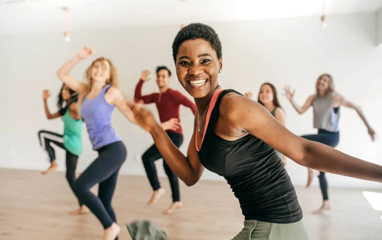 Group of 6 members participating in a class dancing