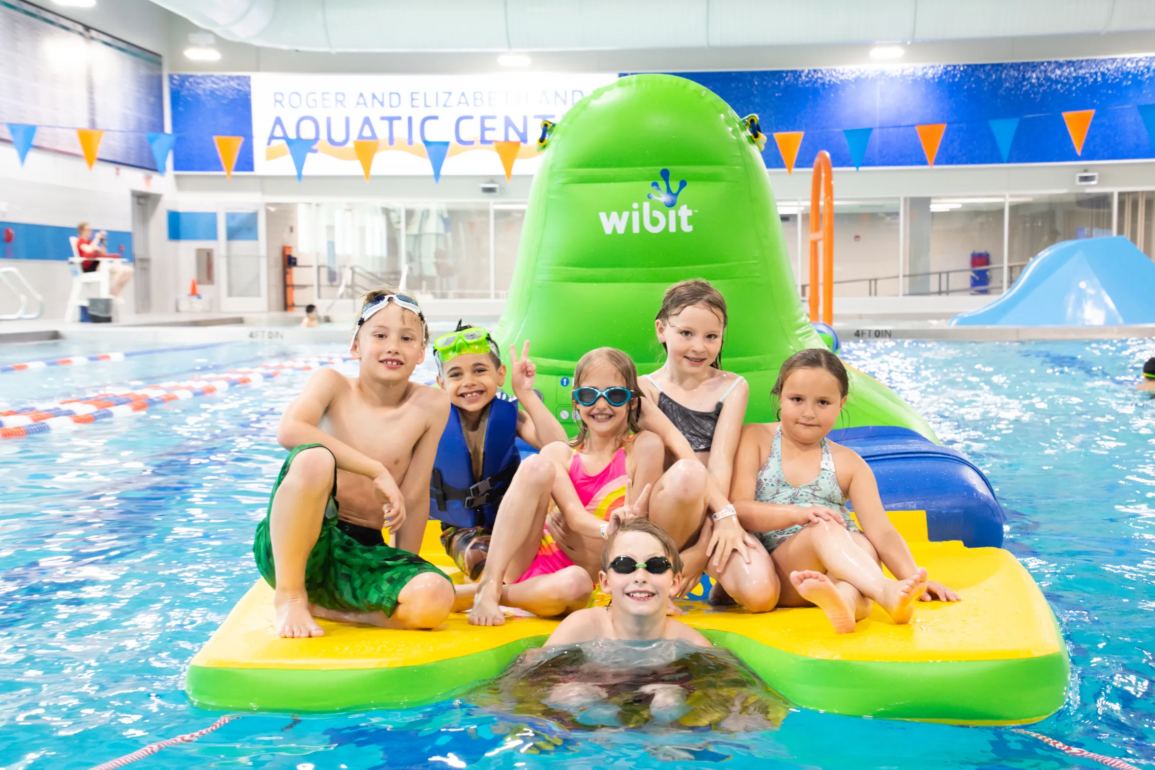 Group of kids playing on a Wibit in the Aquatics Pool