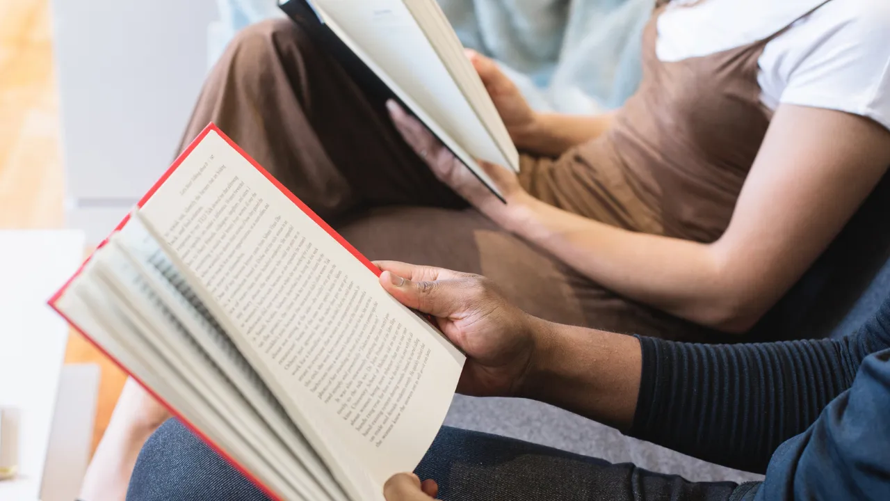Two people reading boks