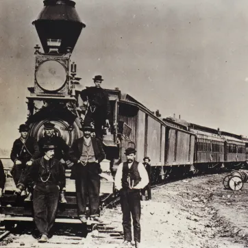 An old historic image of Fargo YMCA and a train