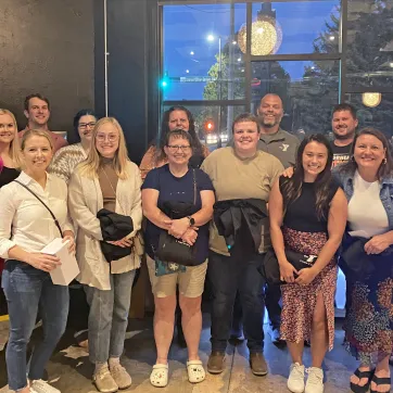 15 staff members grouped together for YMCA Staff Recognition Event 2023